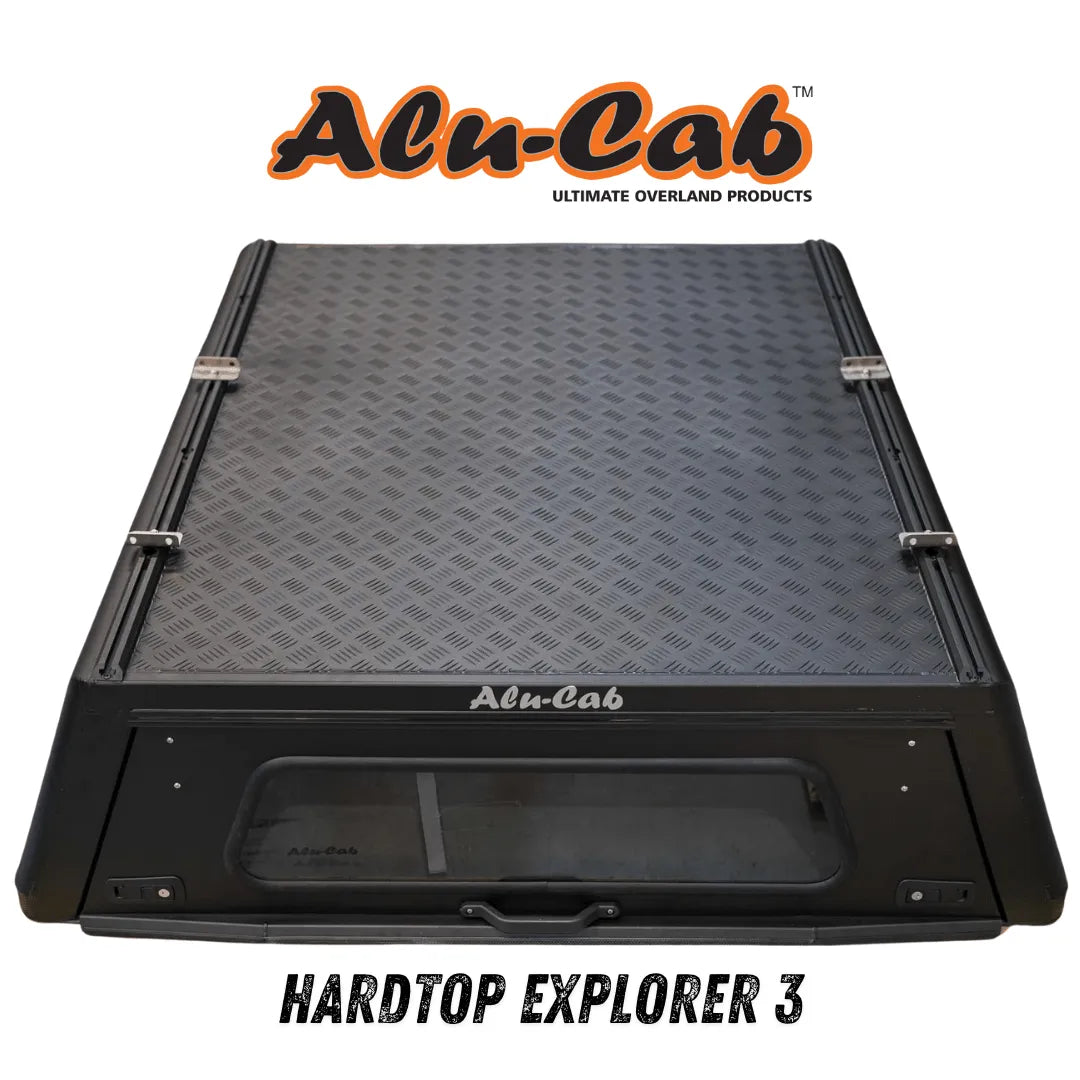 Hardtop Alu-Cab Explorer 3 en aluminium pour Mitsubishi L200 2016+, vue de face montrant la fixation et la finition du toit.