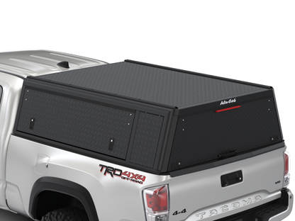 Hardtop Alu-Cab "Guard" pour Toyota Tacoma 2016-2023, version texture, en aluminium robuste, adapté pour le modèle pickup.