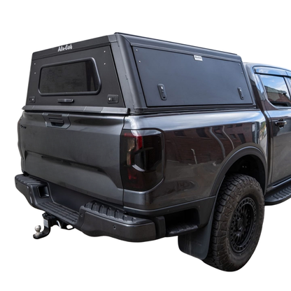 Hardtop en aluminium Alu-Cab Explorer 3 pour VW Amarok 2010-2022, accessoire robuste pour camping et transport.